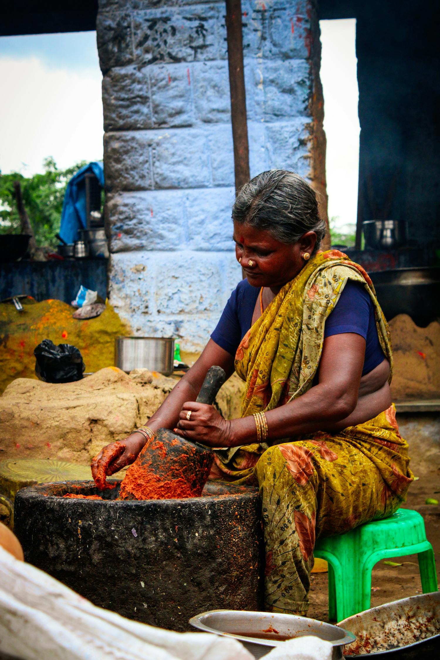 Stone-grinding the dried fruit