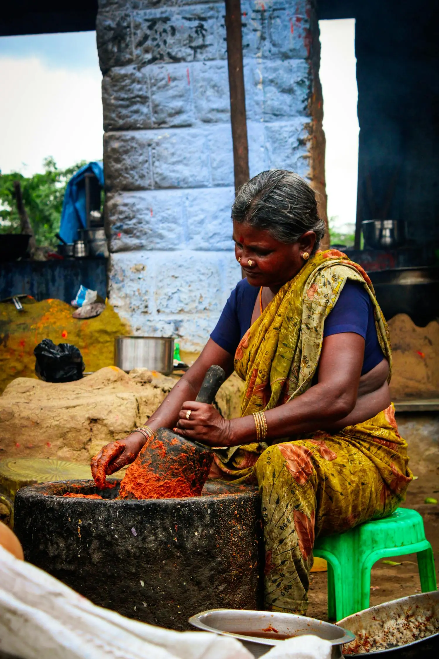 Stone-grinding the dried fruit